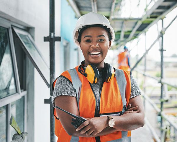 Portrait of a young woman working at a construction site